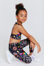 Kids Sports Bra in Black Candy Spill